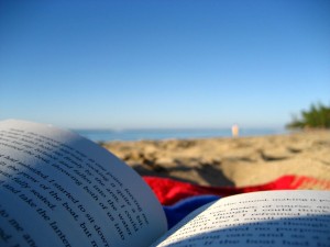 reading a book on the beach