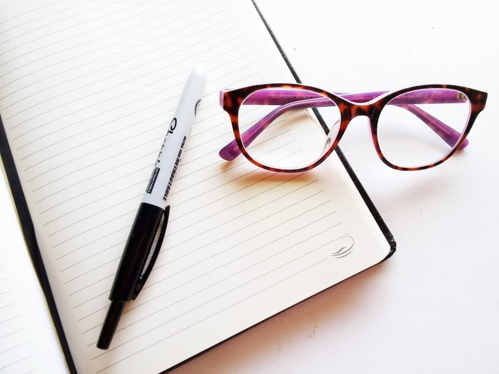 Notebook glasses and pen for writing
