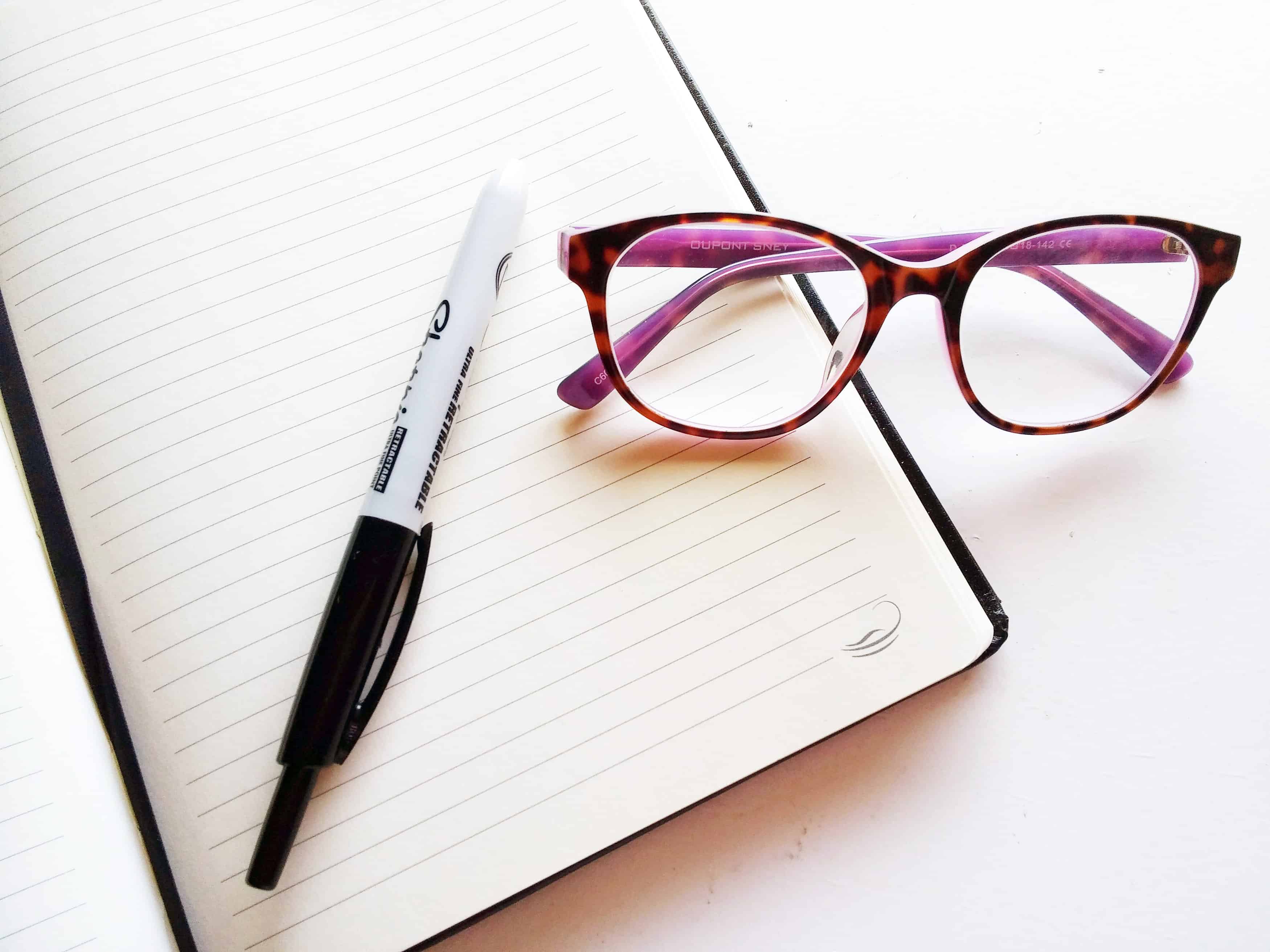 Notebook and glasses