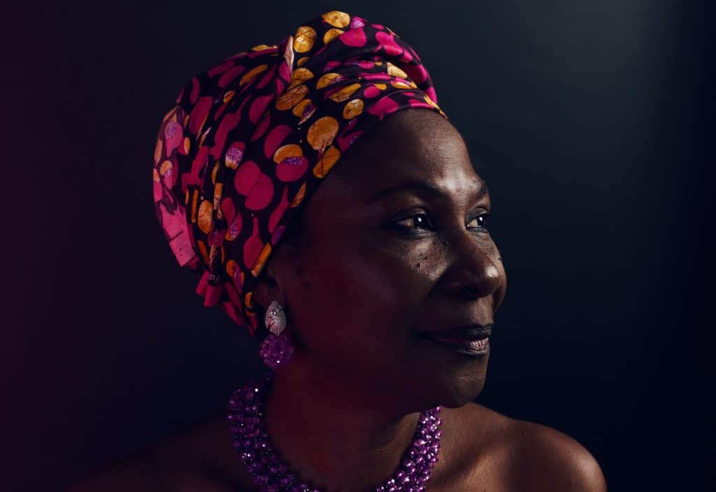 Woman of color with head wrap Celebrate Caribbean Woman History